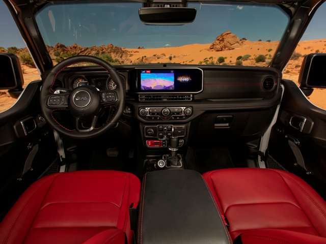 Interior view of the front seat of a 2024 Jeep Wrangler with red seats. | Jeep dealer in Altoona, PA | Courtesy Motor Sales