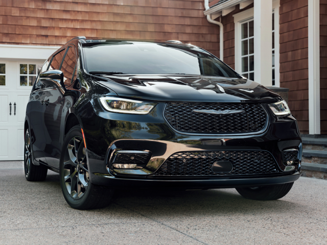 Front view of a black, 2024 Chrysler Pacifica parked in front of a home garage | Chrysler dealer in Altoona, PA | Courtesy Motor Sales