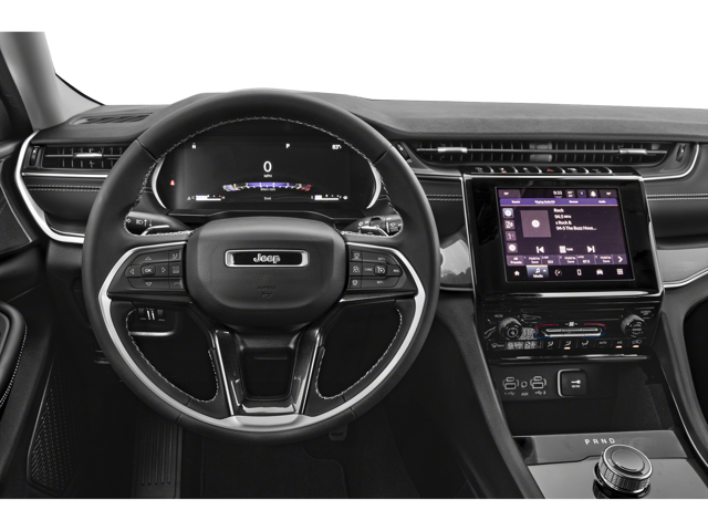 Steering wheel and dashboard area inside of a 2024 Jeep Grand Cherokee | Jeep service center in Altoona, PA | Courtesy Motor Sales