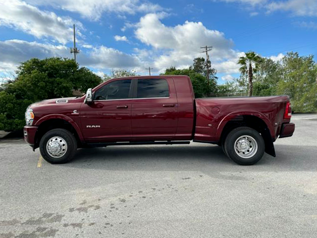 Profile view of a burgundy 2024 Ram 3500 | Ram dealer in Altoona, PA | Courtesy Motor Sales